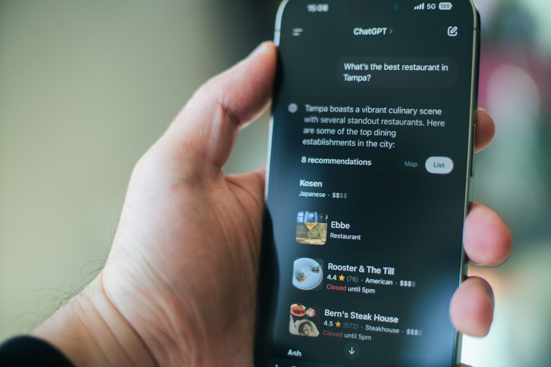 Smartphone with the ChatGPT app open and a user question response